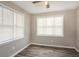 Well-lit bedroom with hardwood floors and window blinds at 3814 N Camp Creek Sw Pkwy, Atlanta, GA 30331
