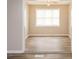 Bright dining room with hardwood floors and large windows at 3814 N Camp Creek Sw Pkwy, Atlanta, GA 30331