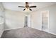 Bedroom with carpet, ceiling fan, and access to bathroom at 4649 Big Valley Ct, Stone Mountain, GA 30083