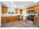 Modern kitchen with light wood cabinets and stainless steel appliances at 4649 Big Valley Ct, Stone Mountain, GA 30083