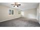 Large bedroom with neutral walls and carpet, ceiling fan at 4649 Big Valley Ct, Stone Mountain, GA 30083