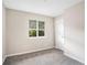 Bright bedroom with neutral walls and carpet at 4649 Big Valley Ct, Stone Mountain, GA 30083