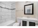 Clean bathroom with white vanity and tile shower/tub at 4649 Big Valley Ct, Stone Mountain, GA 30083