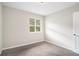 Well-lit bedroom featuring neutral walls and carpet at 4649 Big Valley Ct, Stone Mountain, GA 30083