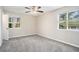 Well-lit bedroom with neutral walls, carpet, and ceiling fan at 4649 Big Valley Ct, Stone Mountain, GA 30083