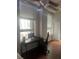 Home office features wood floors and large windows with blinds at 20 Marietta St # 9F, Atlanta, GA 30303