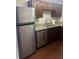 Modern kitchen with stainless steel refrigerator, dishwasher, and sink at 20 Marietta St # 9F, Atlanta, GA 30303