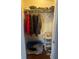 Well-organized closet with hanging rods and shelves at 20 Marietta St # 9F, Atlanta, GA 30303