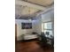 Bright bedroom with wood floors, a workspace, and large windows at 20 Marietta St # 9F, Atlanta, GA 30303