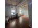 Bright living room with hardwood floors, large windows, and a workspace at 20 Marietta St # 9F, Atlanta, GA 30303