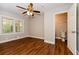 Bedroom with hardwood floors, ceiling fan, and private bathroom at 1868 Longdale Dr, Decatur, GA 30032