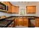Updated kitchen with wood cabinets, granite counters, and stainless steel appliances at 1868 Longdale Dr, Decatur, GA 30032