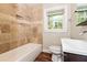 Updated bathroom with tile shower, vanity, and toilet at 1868 Longdale Dr, Decatur, GA 30032