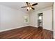 Bedroom with hardwood floors, ceiling fan, and access to private bath at 1868 Longdale Dr, Decatur, GA 30032