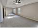 Large main bedroom with ceiling fan and ample natural light at 12497 Lakeside Pkwy, Fayetteville, GA 30215