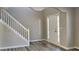 Bright entryway with hardwood floors and staircase at 12497 Lakeside Pkwy, Fayetteville, GA 30215