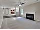 Living Room with fireplace and view into kitchen at 12497 Lakeside Pkwy, Fayetteville, GA 30215