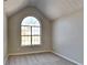 Bright bedroom with an arched window and neutral wall colors at 12497 Lakeside Pkwy, Fayetteville, GA 30215