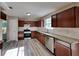 Modern kitchen with stainless steel appliances and granite counters at 12497 Lakeside Pkwy, Fayetteville, GA 30215