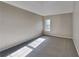 Spacious bedroom with neutral wall colors and carpet flooring at 12497 Lakeside Pkwy, Fayetteville, GA 30215