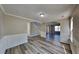 Open dining room with hardwood floors and archways at 12497 Lakeside Pkwy, Fayetteville, GA 30215