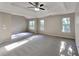 Main bedroom with vaulted ceilings and carpet flooring at 12497 Lakeside Pkwy, Fayetteville, GA 30215