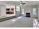 Living Room with fireplace and view into kitchen at 12497 Lakeside Pkwy, Fayetteville, GA 30215