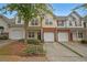 Brick and siding townhouses with attached garages at 2359 Suwanee Pointe Dr, Lawrenceville, GA 30043