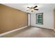 Bright bedroom featuring a window and ceiling fan at 116 Southside Dr, Villa Rica, GA 30180