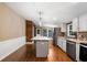 Kitchen with island, stainless steel appliances, and hardwood floors at 116 Southside Dr, Villa Rica, GA 30180
