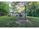 Ranch-style home with a large backyard and deck at 116 Southside Dr, Villa Rica, GA 30180
