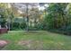 Spacious backyard with lush greenery and large trees at 116 Southside Dr, Villa Rica, GA 30180