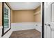 Laundry room with window, vinyl flooring, and built-in shelving at 116 Southside Dr, Villa Rica, GA 30180