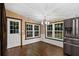 Dining area with hardwood floors, chandelier and access to outside at 116 Southside Dr, Villa Rica, GA 30180