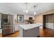 Modern kitchen with white cabinets and large island at 116 Southside Dr, Villa Rica, GA 30180