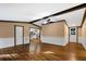 Open living room with hardwood floors and views into kitchen and hallway at 116 Southside Dr, Villa Rica, GA 30180