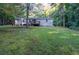 Spacious backyard with large grassy area and deck at 116 Southside Dr, Villa Rica, GA 30180
