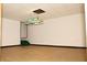Spacious basement with laminate flooring and a pool table light fixture at 3219 Boulder Brook Dr, Lithonia, GA 30038