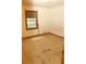 Small bedroom with carpeted floor and a window at 3219 Boulder Brook Dr, Lithonia, GA 30038