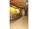 Unfinished basement with wood shelving and laminate flooring at 3219 Boulder Brook Dr, Lithonia, GA 30038