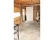 Unfinished garage with water heater and concrete floor at 3219 Boulder Brook Dr, Lithonia, GA 30038