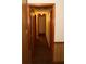 Long hallway with carpeted floors and wooden doors at 3219 Boulder Brook Dr, Lithonia, GA 30038