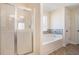 Bathroom with shower, garden tub, and tile flooring at 188 Sophie Cir, Locust Grove, GA 30248