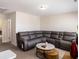 Spacious bonus room with sectional sofa and large windows at 188 Sophie Cir, Locust Grove, GA 30248