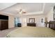 Main bedroom with king-size bed, large windows, and a view of the bathroom at 188 Sophie Cir, Locust Grove, GA 30248