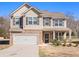 Two-story house with brick and siding exterior at 188 Sophie Cir, Locust Grove, GA 30248