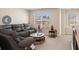 Comfortable bonus room with a sectional sofa and plenty of natural light at 188 Sophie Cir, Locust Grove, GA 30248