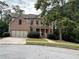 Brick two-story home with a two car garage and landscaping at 6230 Huntington Ridge Se Rd, Mableton, GA 30126