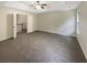 Large main bedroom with carpet, ceiling fan, and access to the loft at 6566 Splitpine Ct, Atlanta, GA 30349