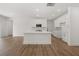 Modern kitchen with white cabinets, center island, and stainless steel appliances at 2808 Cromwell Ln, Snellville, GA 30039